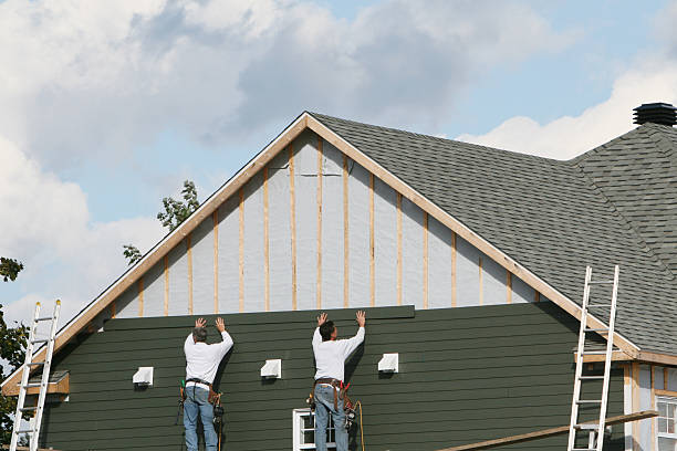 Professional Siding technician working in Hicksville, NY